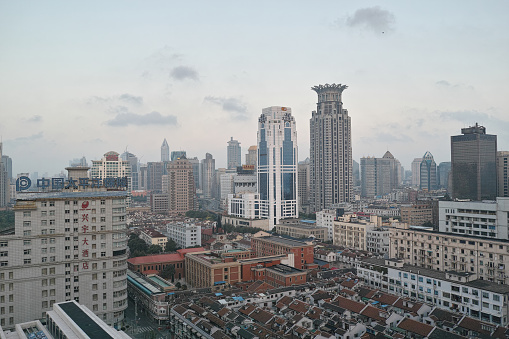 Shanghai, China - September 28, 2015:  modern building and the roof of historic buildings viewed from Bund SOHO.
