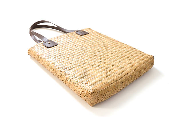 Straw bag on a white background Straw bag on a white background straw bag stock pictures, royalty-free photos & images