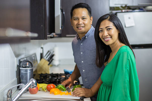 istock Young ethnic couple cooking in kitchen 490505706