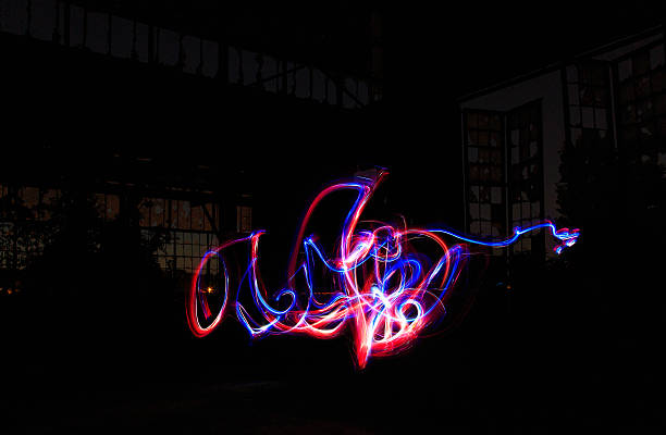 istock Abandoned factory at sunset with glowing lights inside 490506648