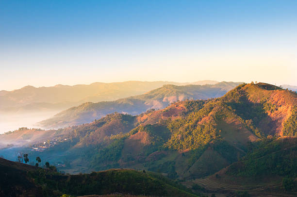 Panoramic view misty morning sunrise in mountain at north Thailand