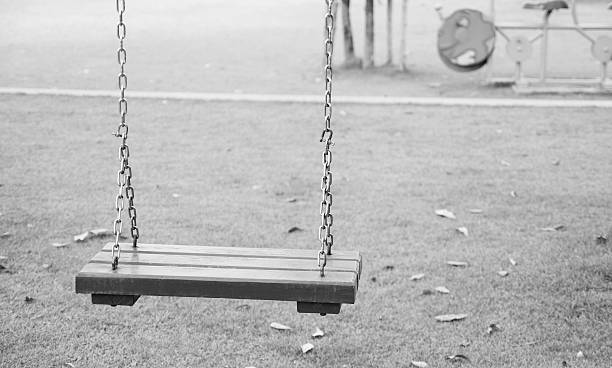 istock swing hanging in garden monochrome 490510976