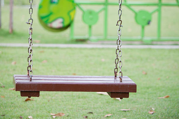 istock swing hanging in garden 490511088