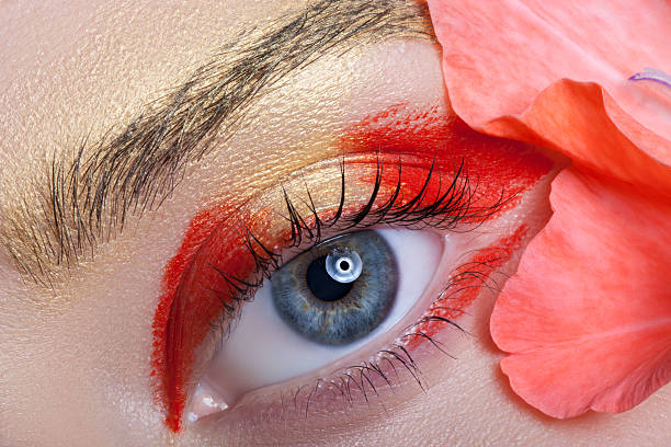 istock Beautiful eye make-up and flowers. 490512114