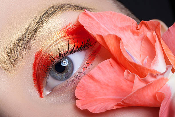 istock Beautiful eye make-up and flowers. 490512198