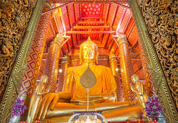 Golden Buddha Statue at Wat Phanan Choeng temple Golden color The Buddha Statue in the ubosot at Wat Phanan Choeng temple, Ayutthaya, Thailand, World Heritage Site  wat phananchoeng stock pictures, royalty-free photos & images