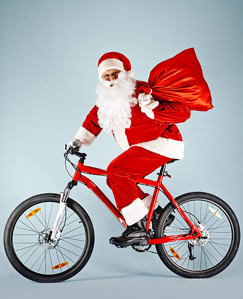 istock Happy Santa on bicycle 490514560