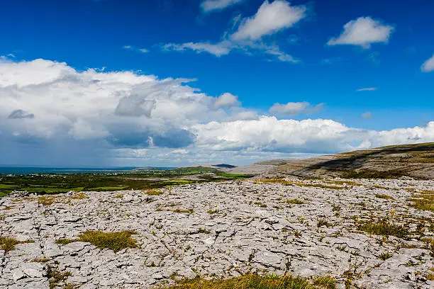 Burren region, Clare, Ireland - August 23, 2010: The Burren measures 250 square kilometres and is enclosed roughly within the circle made by the villages of Ballyvaughan, Kilfenora and Lisdoonvarna.Burren region, Clare, Ireland - August 23, 2010: The Burren measures 250 square kilometres and is enclosed roughly within the circle made by the villages of Ballyvaughan, Kilfenora and Lisdoonvarna.