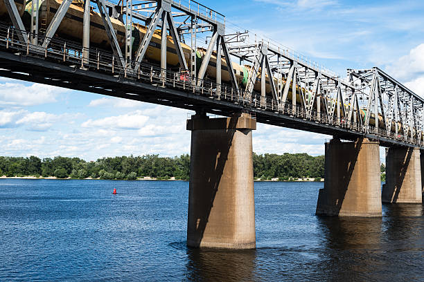 istock Railroad bridge in Kyiv across the Dnieper with freight train 490515614