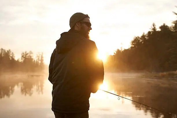 Shot of a man out fishing on a lake at sunsethttp://195.154.178.81/DATA/i_collage/pu/shoots/805654.jpg