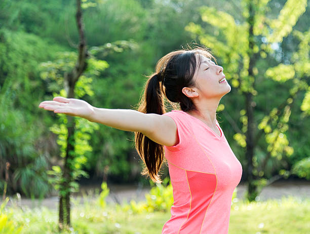 istock Asian woman enjoying fresh air 490516120