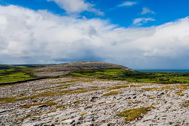 Burren region, Clare, Ireland - August 23, 2010: The Burren measures 250 square kilometres and is enclosed roughly within the circle made by the villages of Ballyvaughan, Kilfenora and Lisdoonvarna.Burren region, Clare, Ireland - August 23, 2010: The Burren measures 250 square kilometres and is enclosed roughly within the circle made by the villages of Ballyvaughan, Kilfenora and Lisdoonvarna.