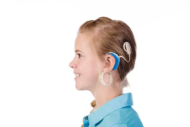 Photo of Blond girl with cochlear implant