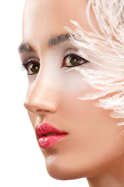 pretty young woman with pink feathers around the head