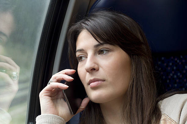 istock sad conversation with a mobile phone in the train 490522359