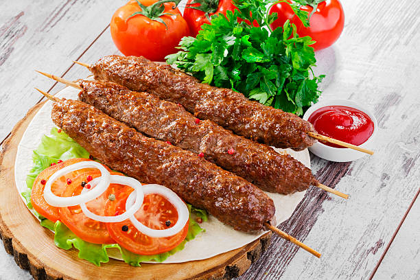 istock shish kebabs on wooden skewers 490523765