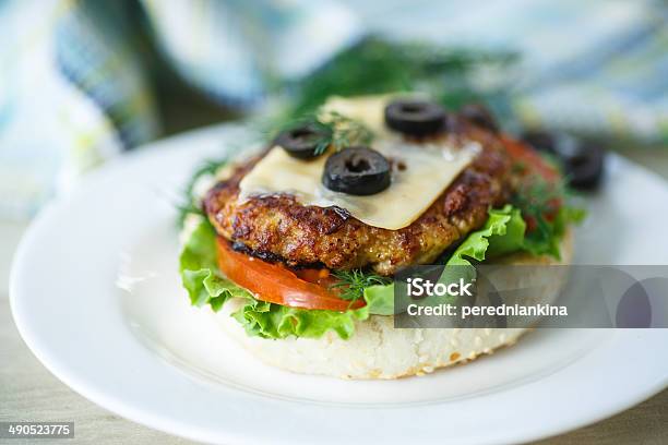 Tasty Hamburger With Lettuce And Tomato Stock Photo - Download Image Now - American Culture, Bacon, Barbecue - Meal