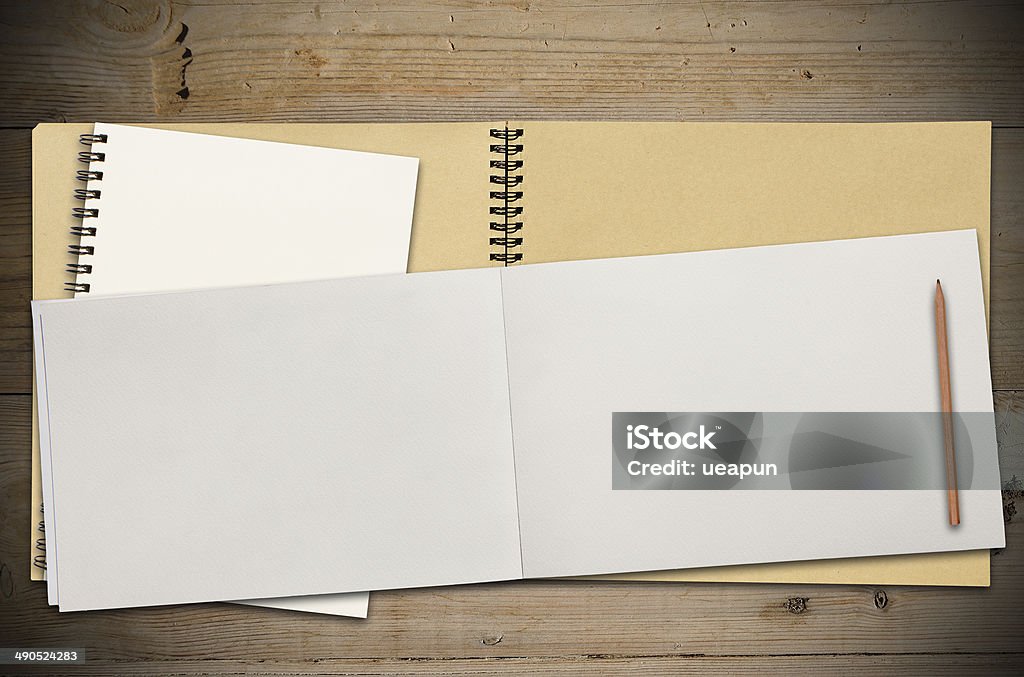 Open Vintage Sketchbook Open Vintage Sketchbook or Notebook on Modern Wooden Table Blank Stock Photo