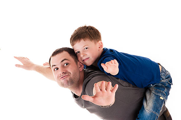 istock happy father and son flying 490524307