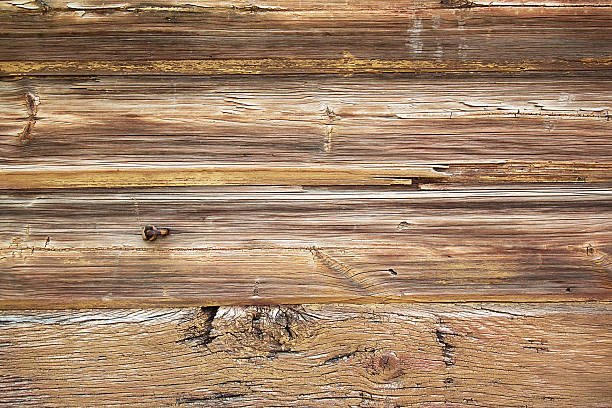 istock Background of dark coarse treated boards 490525655