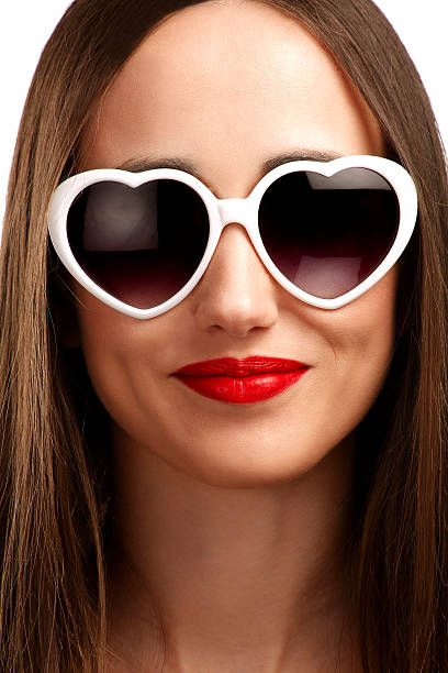 istock Young smiling girl with heart-shaped glasses 490525687