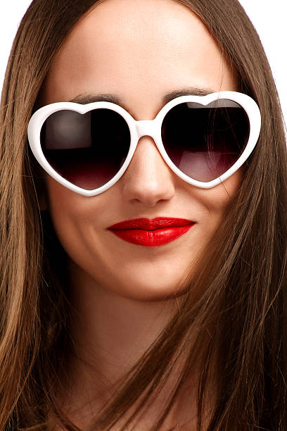 istock Young smiling girl with heart-shaped glasses 490525689