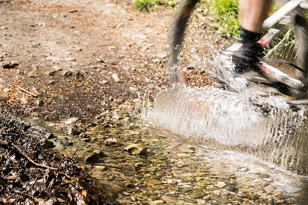 istock MTB and naked legs breaking water 490527855