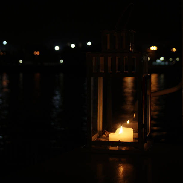 istock Lantern with burning candle. Aged photo. 490542210