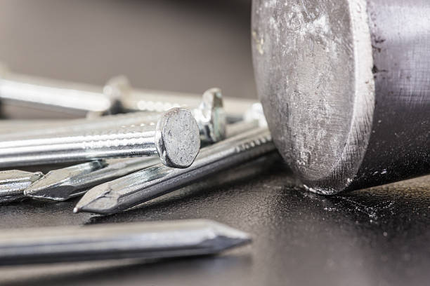 istock Nail and hammer, Close up 490542832