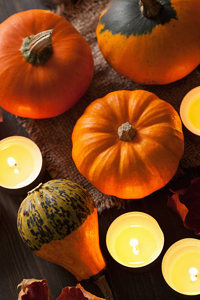 istock decorative halloween pumpkins and candles 490544438