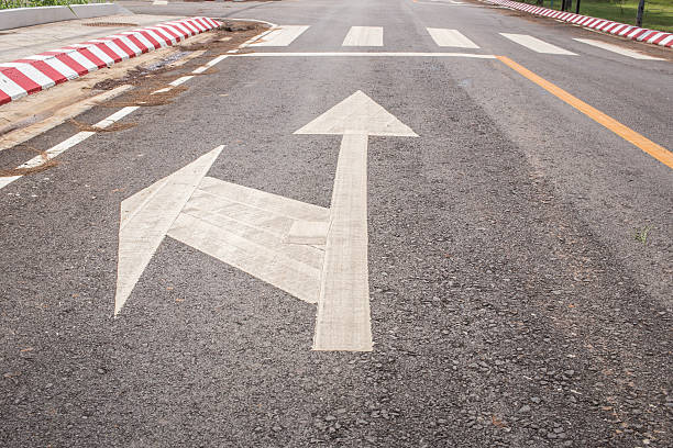 istock Road with an arrow straight and turn left 490545436