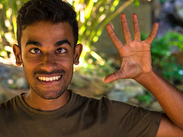 istock Portret of young making fun with his face, Sri Lanka 490545706