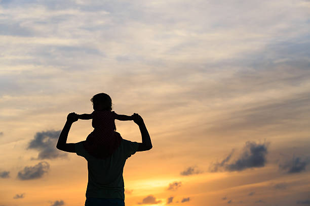 istock father and daughter having fun at sunset 490545936
