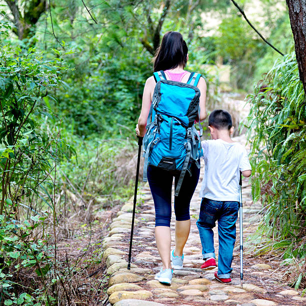 istock Asian mother and sons hiking 490546740
