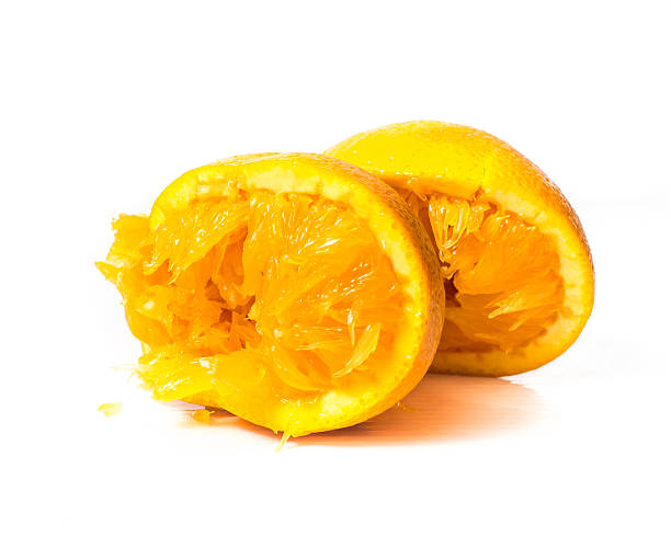 istock Then squeeze the orange on a white background 490548308