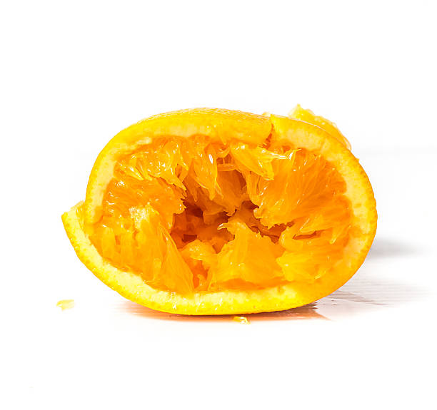istock Then squeeze the orange on a white background 490548326
