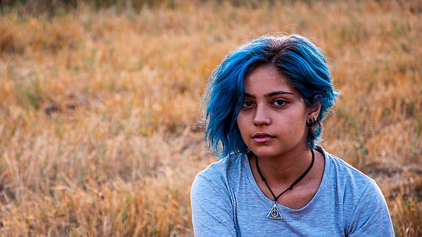 istock blue-haired girl's portrait 490550408