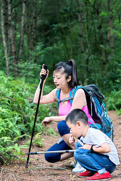 istock Asian mother and sons hiking 490550460