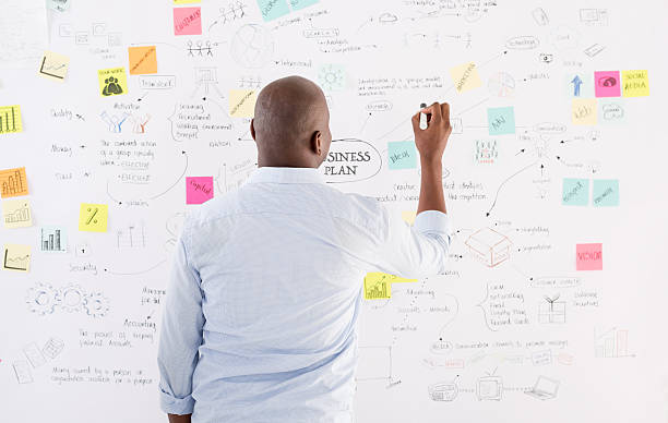 istock Business man drawing a plan at the office 490551050