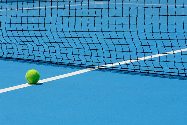 istock Tennis Ball on court 490551618