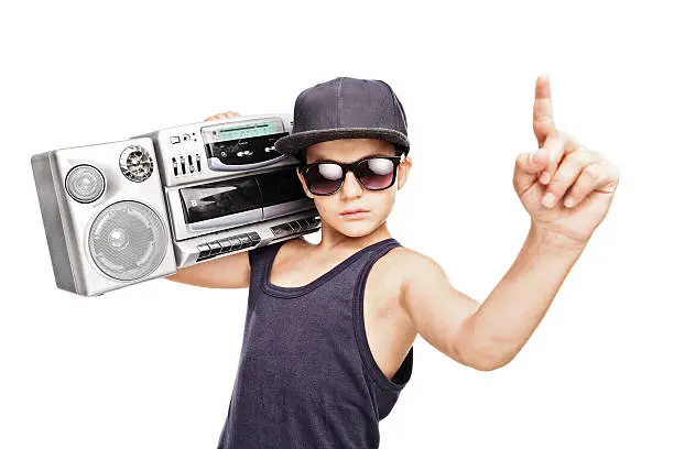 Photo of Junior rapper carrying a ghetto blaster and gesturing