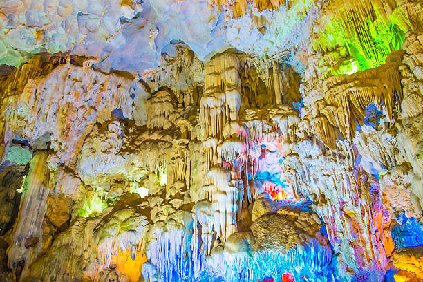istock Famous cave in Halong bay illuminated by colorful lights 490553629