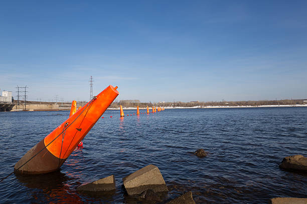 istock orange buoy on water closeup 490553899