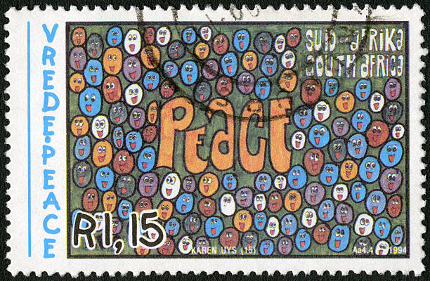 istock Postage stamp South Africa 1994 shows Faces surrounding peace 490553921
