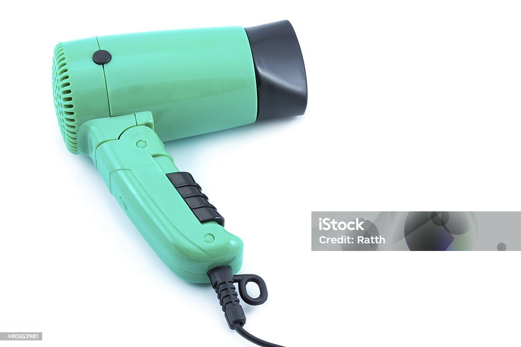 Compact green hair dryer Compact green hair dryer on a white background Blowing Stock Photo