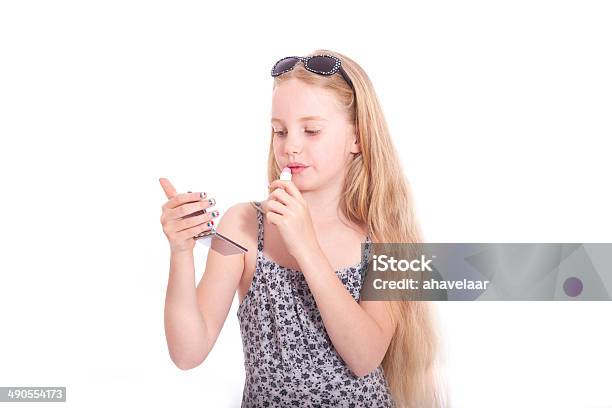 Young Blond Girl With Sunglasses Applying Lipstick In Studio Stock Photo - Download Image Now