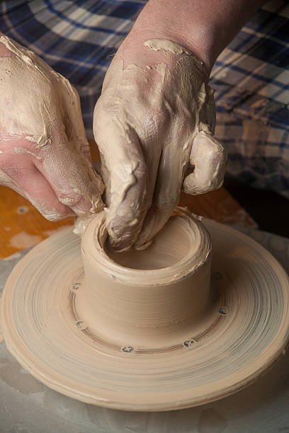 istock Hands of a potter 490554605