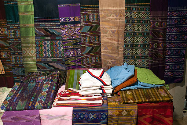 istock Traditional clothes Lua minority show on table and hanging. 490555104