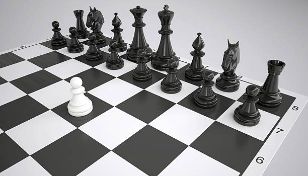 istock White pawn before the army of black chess pieces 490555371