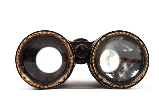 Antique vintage binoculars isolated on a white background